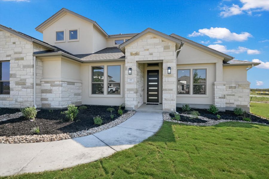 Representative exterior photo of a completed home built from the Ingram II by Giddens Homes in Whispering Wind, Bertram, TX (Image 28).