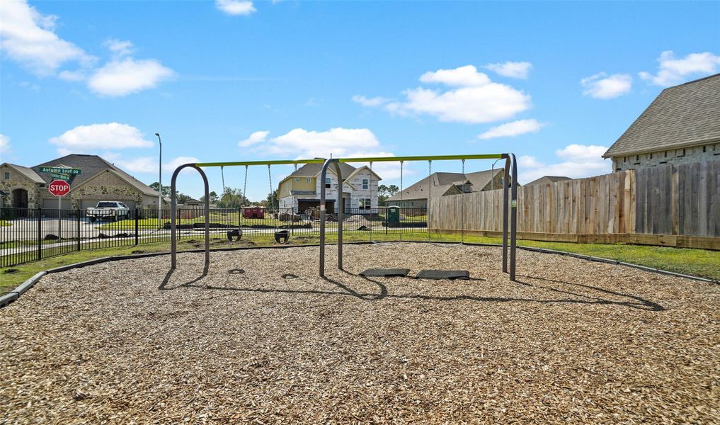 Neighborhood playground with swings.