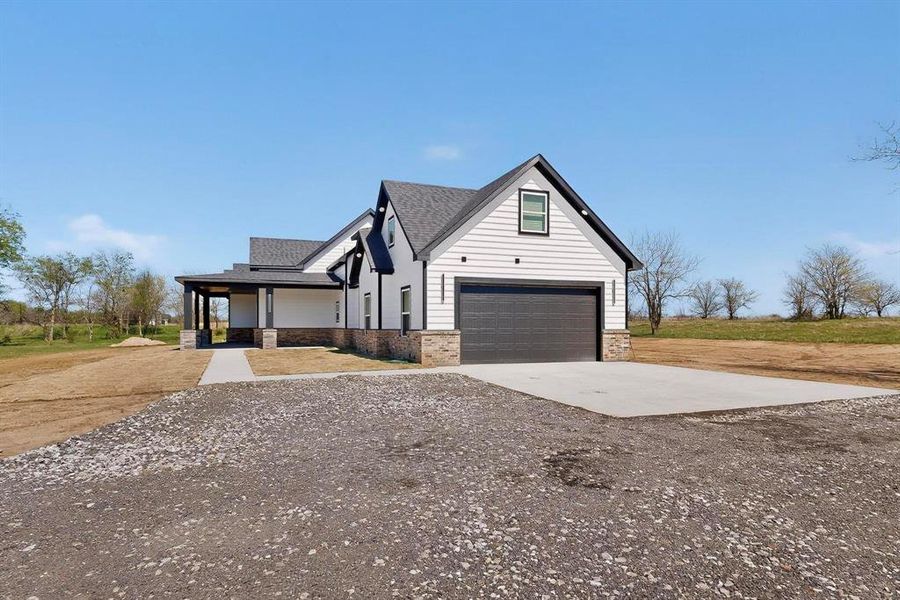 Front exterior of a new home in , Sulphur Springs, TX, highlighting curb appeal (Image 20).