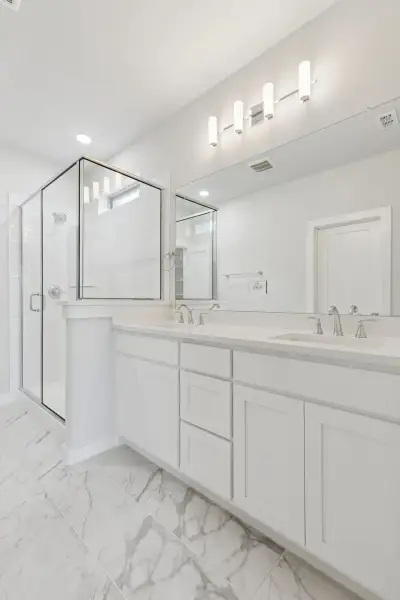 Primary Bathroom in the Stanley II home plan by Trophy Signature Homes – REPRESENTATIVE PHOTO