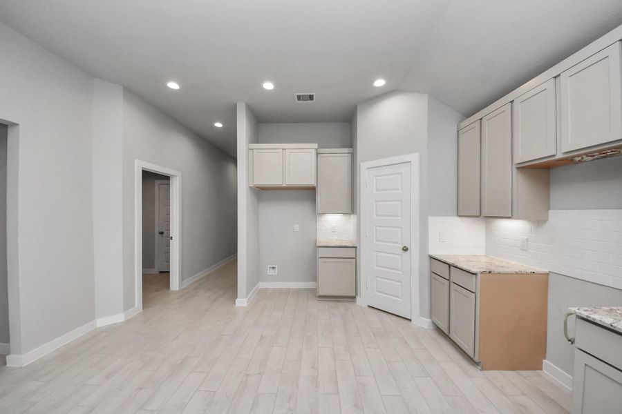 This generously spacious kitchen is a dream realized! Sample photo of completed home with similar floor plan. Actual colors and selections may vary.Sample photo of completed home with similar floor plan. Actual colors and selections may vary.