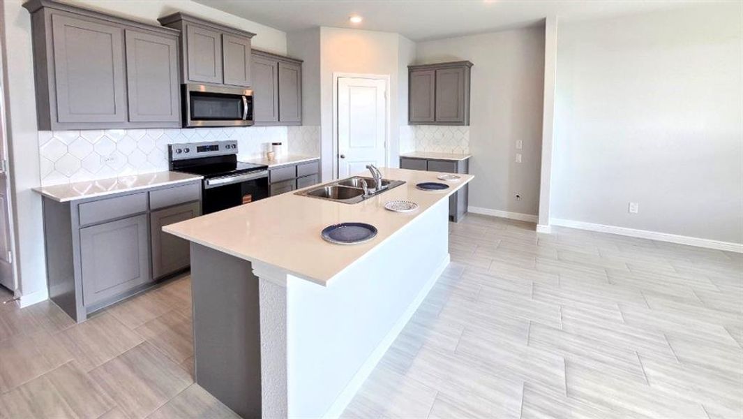 Kitchen - All Home and community information, including pricing, included features, terms, availability and amenities, are subject to change at any time without notice or obligation. All Drawings, pictures, photographs, video, square footages, floor plans, elevations, features, colors and sizes are approximate for illustration purposes only and will vary from the homes as built.