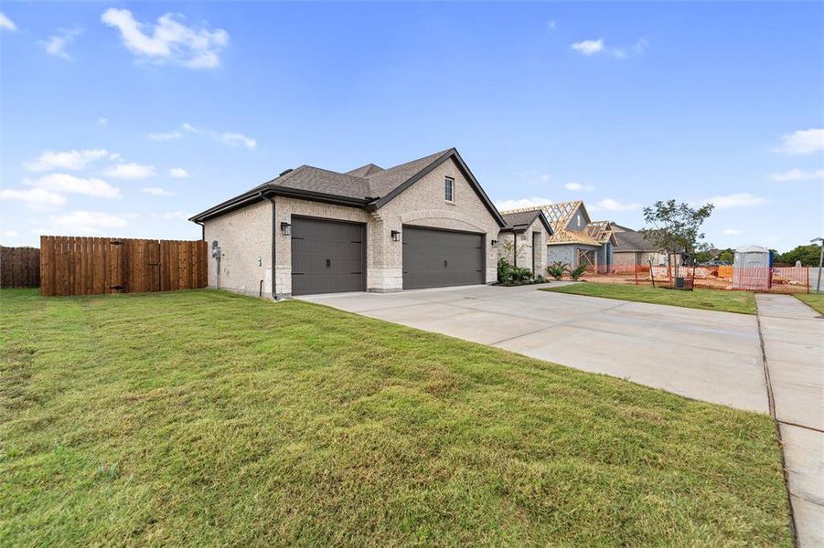 View of front of property featuring brick siding, concrete driveway, a garage, and a shingled roof View of front of property featuring brick siding, concrete driveway, a garage, and a shingled roof