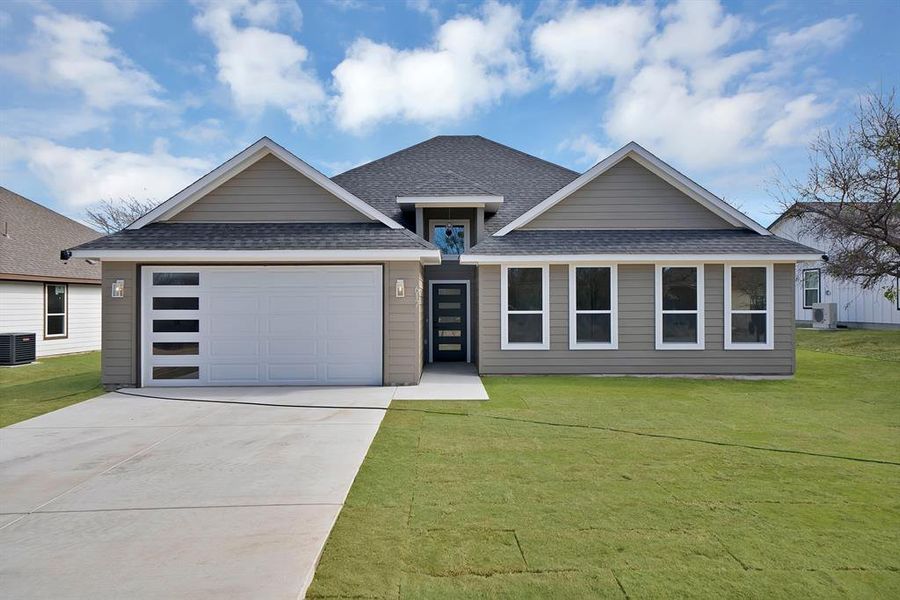 Front exterior of a new home in , Runaway Bay, TX, highlighting curb appeal (Image 2). Front exterior of a new home in , Runaway Bay, TX, highlighting curb appeal (Image 2).