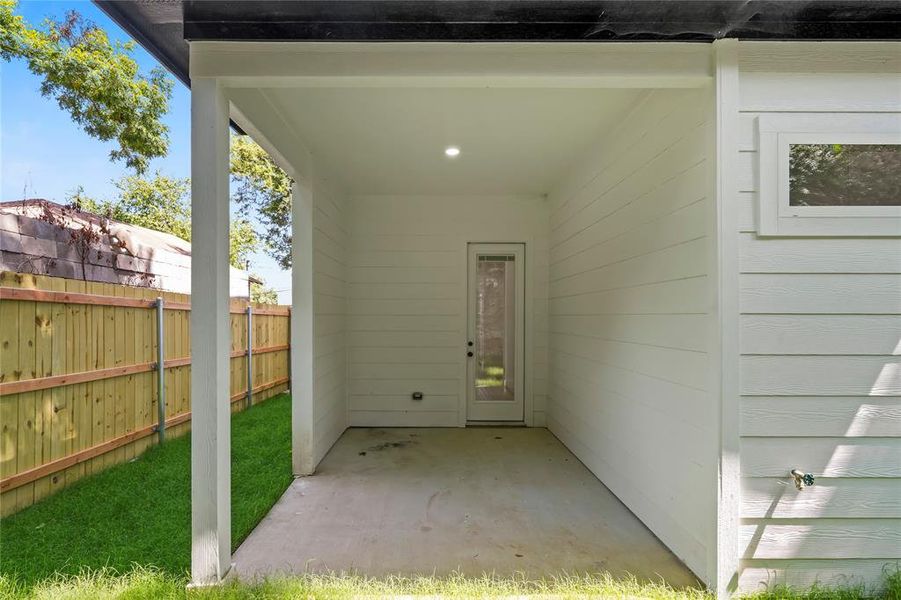 View of exterior entry featuring a patio
