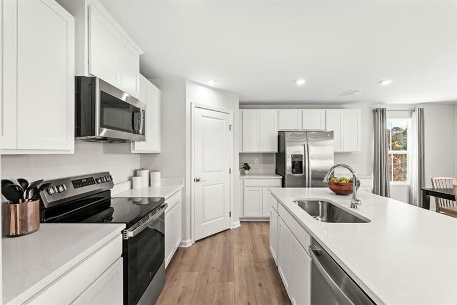 Representative furnished interior of a home built from the Woodford by Ryan Homes in Oakwood Trace, Fairburn (Image 7).