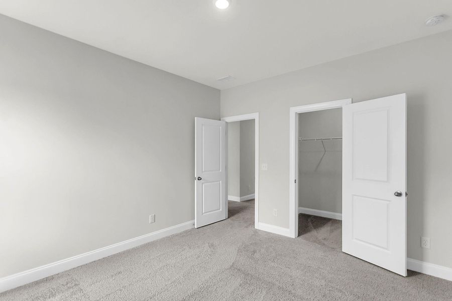 Spacious, unfurnished interior of a new home in Tidewater at Lakes of Cane Bay, Summerville (Image 28).