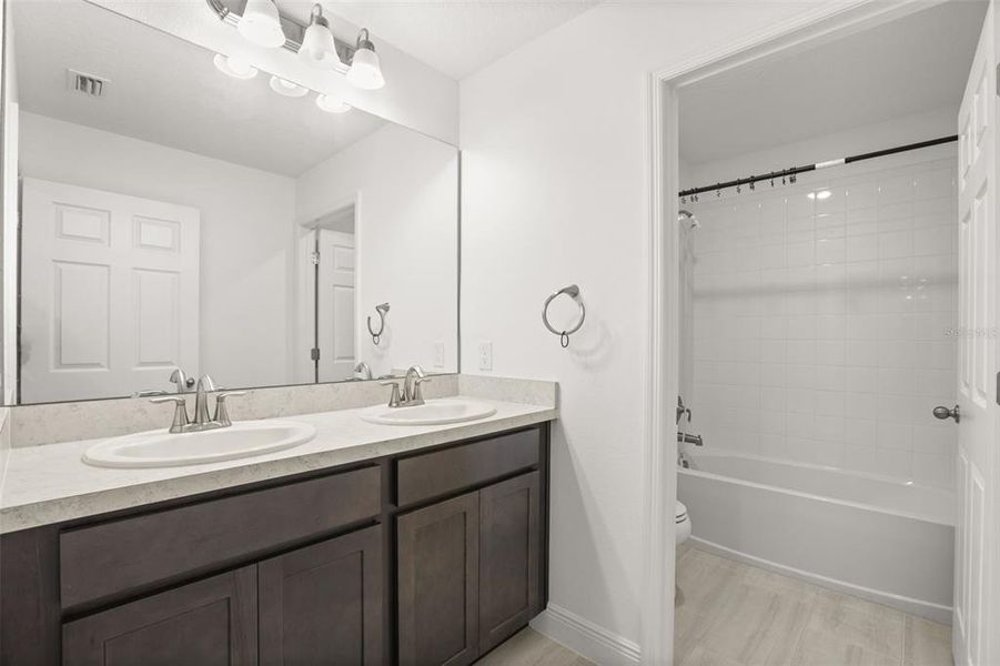 Furnished interior view inside a new home in Beresford Woods, Deland (Image 31). Furnished interior view inside a new home in Beresford Woods, Deland (Image 31).