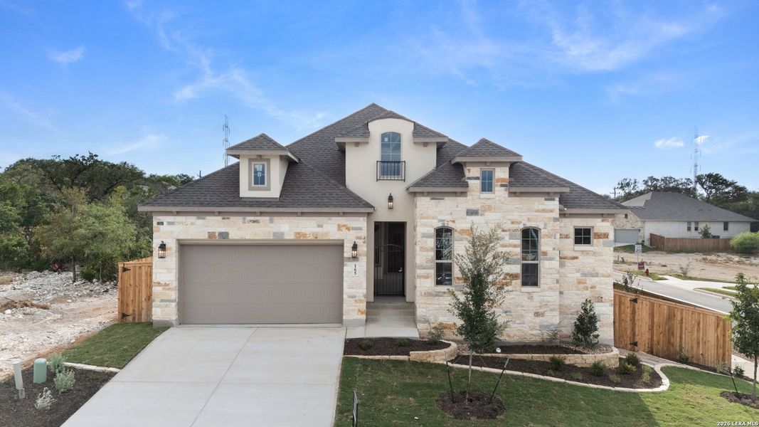 Front exterior of a new home in Cibolo Crossing, Universal City, TX, highlighting curb appeal (Image 21).