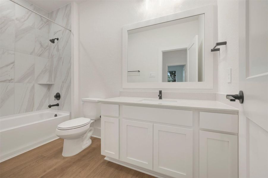 Furnished interior view inside a new home in The Oaks on 6th Street, Magnolia (Image 10).