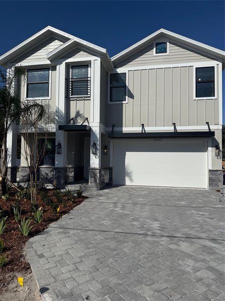 Front exterior of a new home in , Tampa, FL, highlighting curb appeal (Image 16).