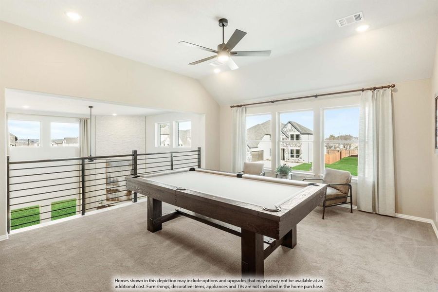 Upstairs game room with pool table, vaulted ceiling, ceiling fan, and open railing overlooking lower level
