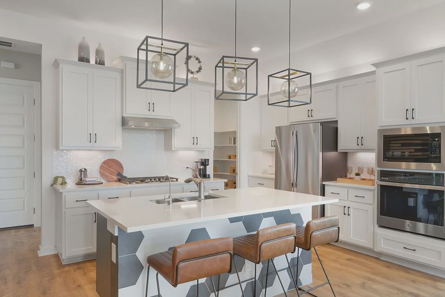 Representative furnished interior of a home built from the Adalynn by Chesmar Homes in Carillon, Boerne (Image 3).
