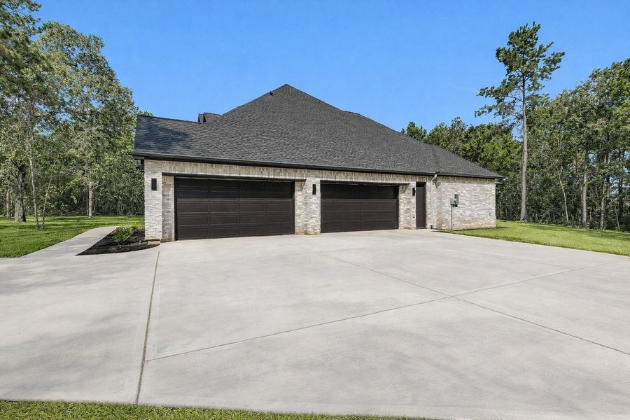 Unbelievable 4+ car garage also features a designated workshop area to allow for extra storage.
