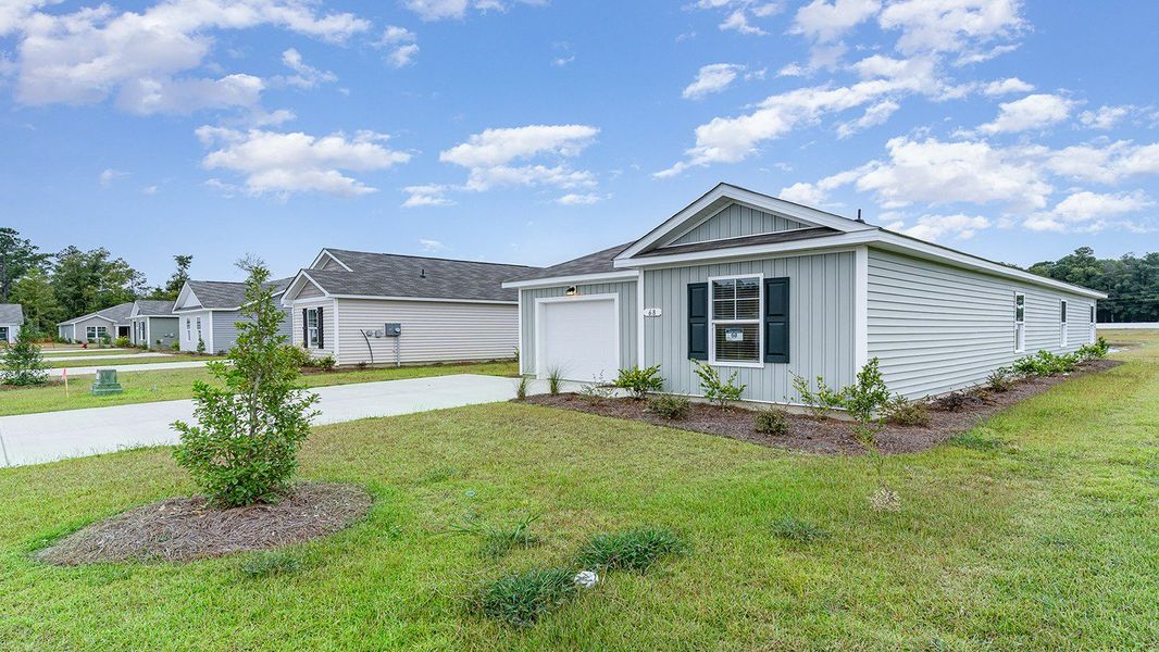 Representative exterior photo of a completed home built from the Cameron by D.R. Horton in The Bluffs at Mill Creek, Florence, SC (Image 16).