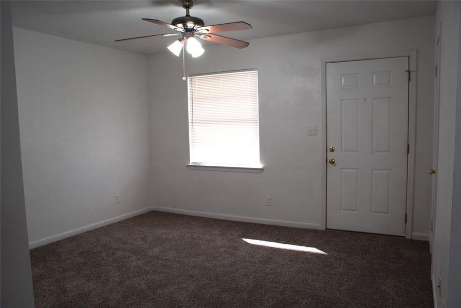 Entry door and area used for dinning. Entry closet to the right of the entry door.