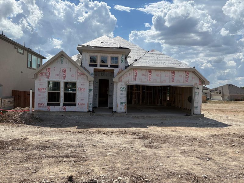 Property under construction featuring a garage