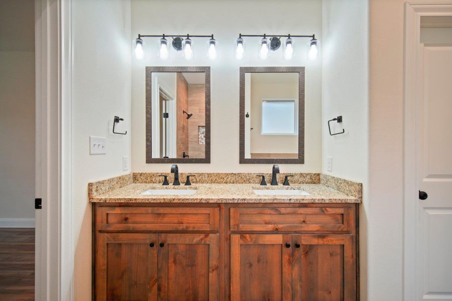 Bathroom featuring double vanity and a sink