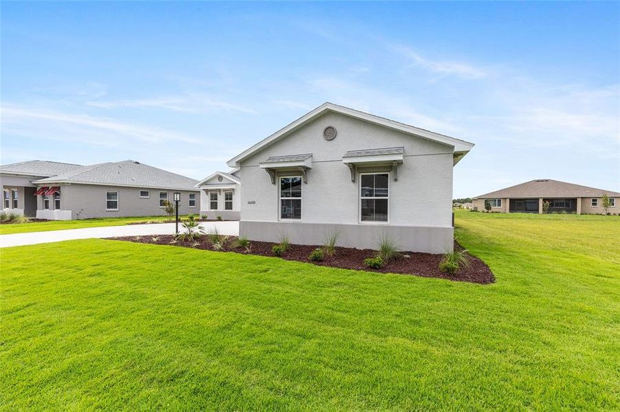 Exterior details and patio area of a home in On Top of the World Communities, Ocala (Image 25).