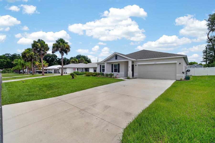 Front exterior of a new home in , Edgewater, FL, highlighting curb appeal (Image 22). Front exterior of a new home in , Edgewater, FL, highlighting curb appeal (Image 22).