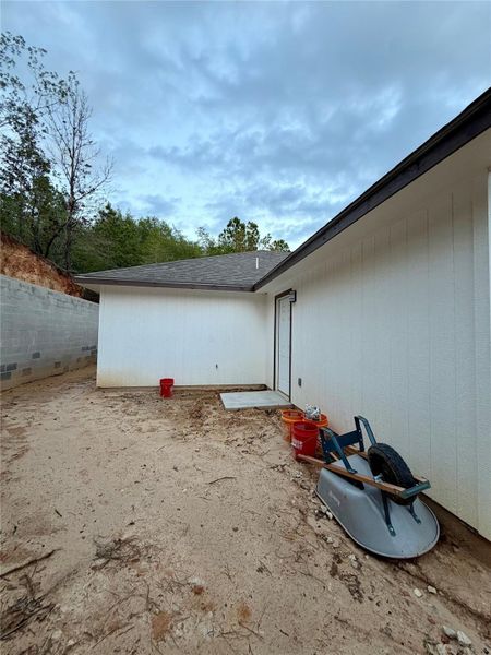 White exterior siding with a dark trim roofline
