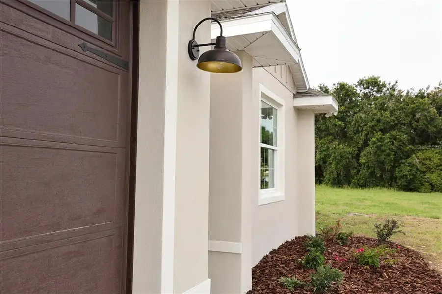 Exterior details and patio area of a home in , Sebring (Image 3).