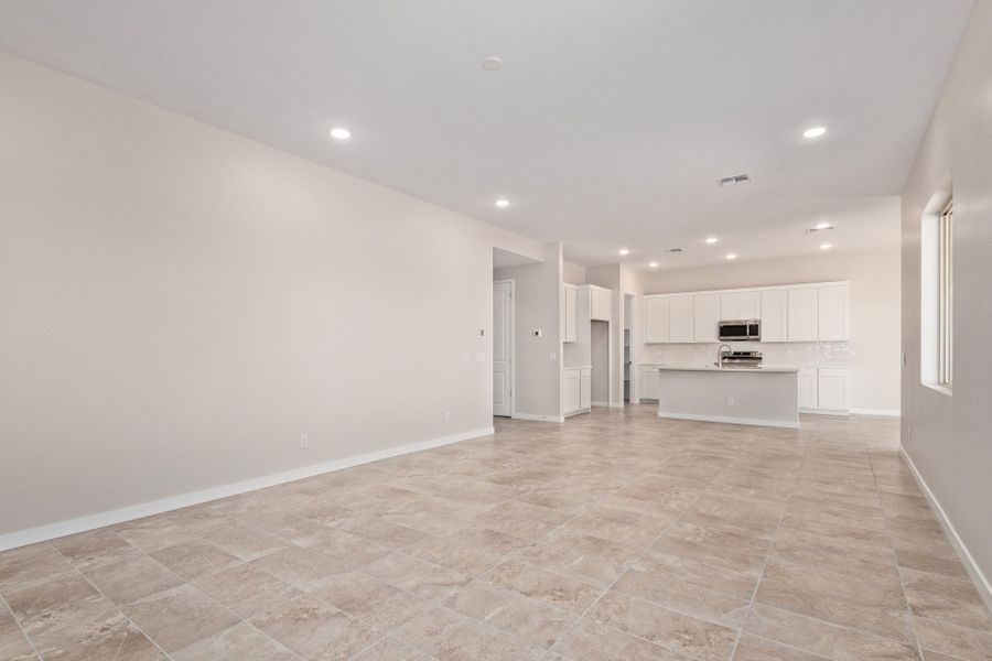 Spacious, unfurnished interior of a new home in Wildera, Queen Creek (Image 9).