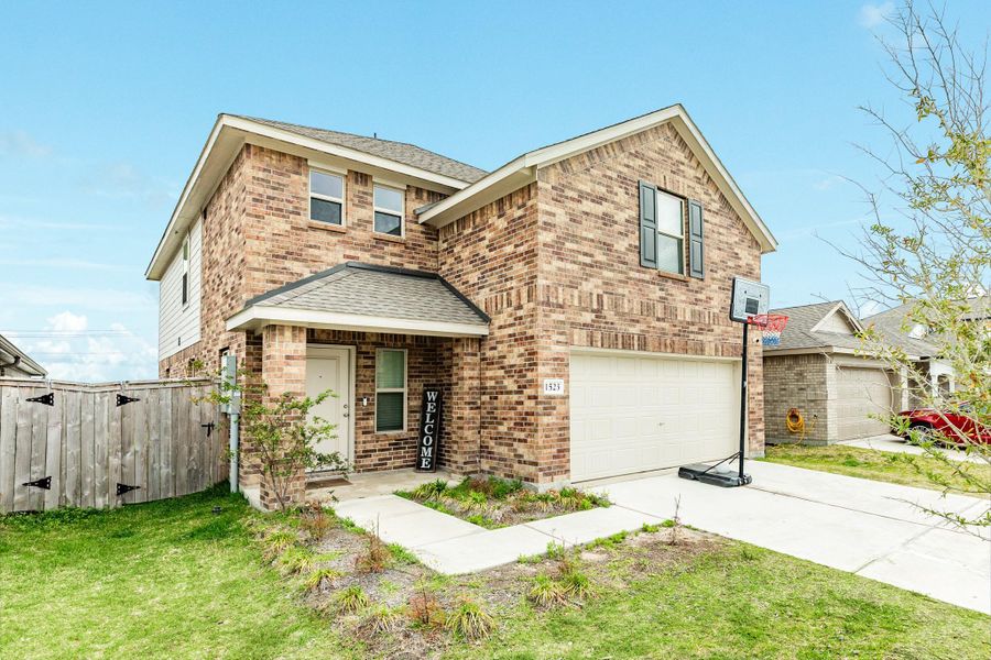 Front exterior of a new home in Windrose Green, Angleton, TX, highlighting curb appeal (Image 22).