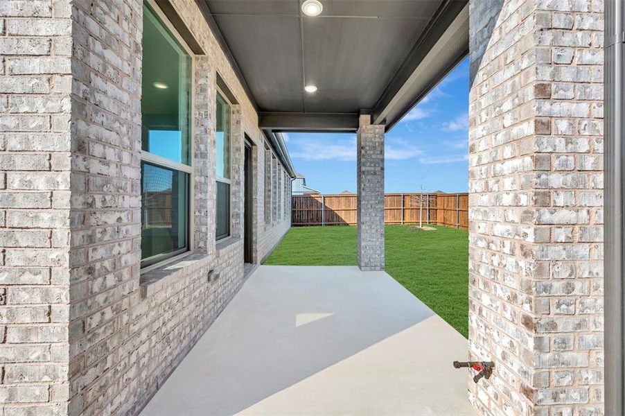 Exterior details and patio area of a home in Lily Creek at Sutton Fields, Aubrey (Image 20). Exterior details and patio area of a home in Lily Creek at Sutton Fields, Aubrey (Image 20).
