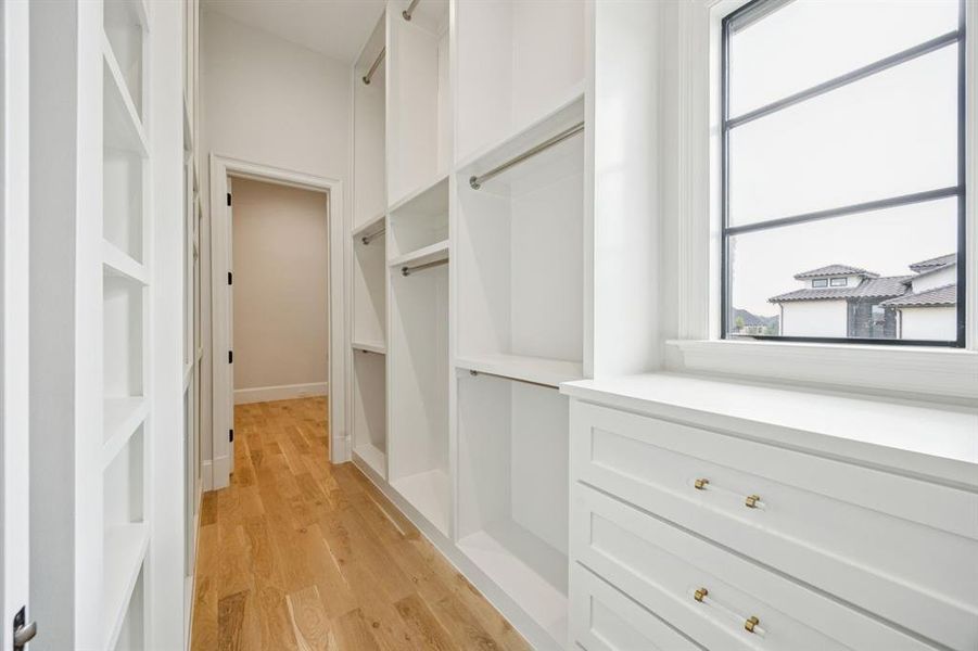 One of the two primary suite closets.  This one has a safe room/flex space on the other side. Second primary closet has second utility area with W/D hookup