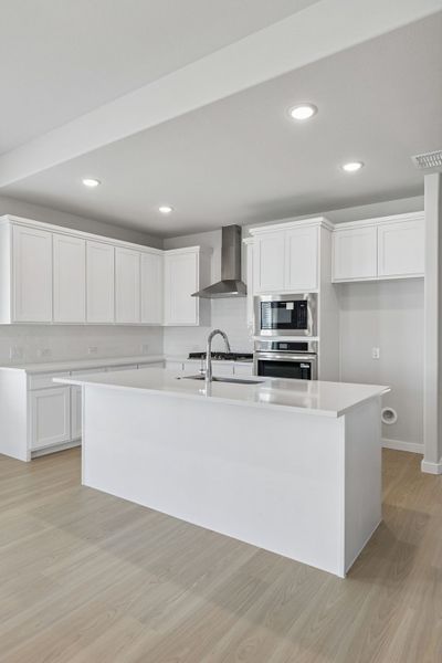 Kitchen in the Stanley II home plan by Trophy Signature Homes – REPRESENTATIVE PHOTO