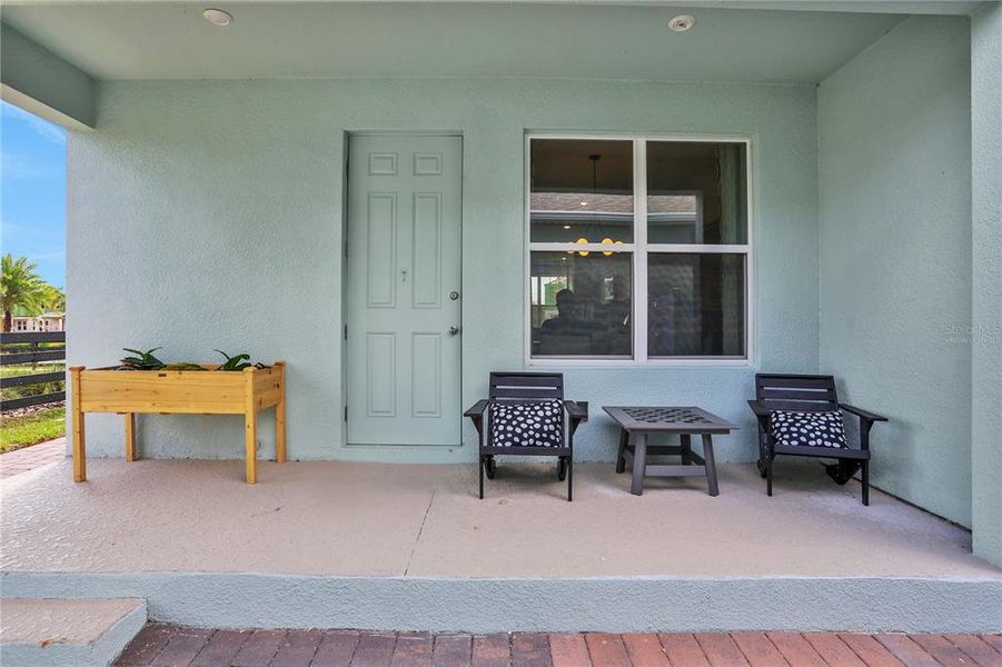 Exterior details and patio area of a home in Serenade at Ovation, Winter Garden (Image 22).