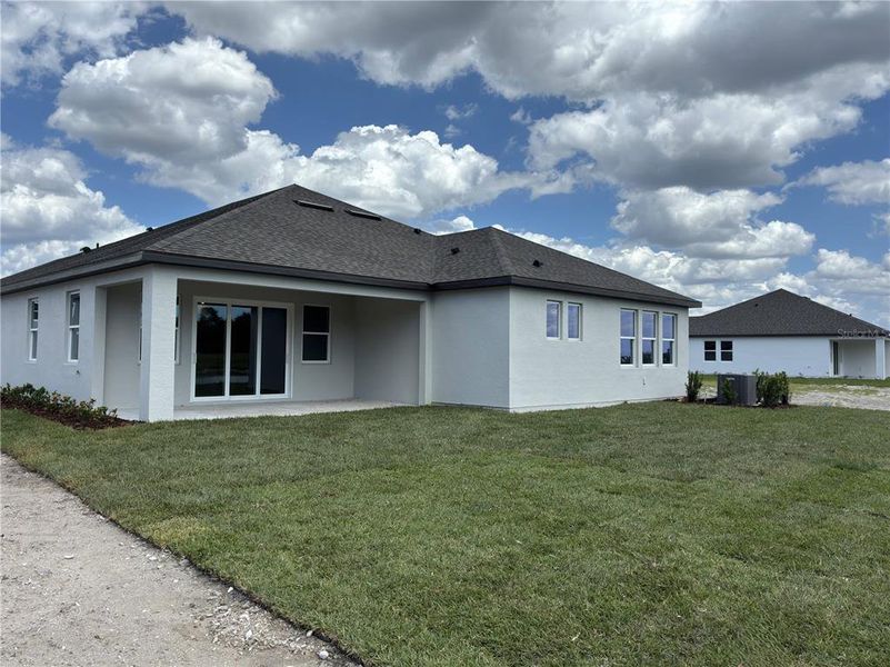 Exterior details and patio area of a home in Oakfield Trails, Parrish (Image 20).