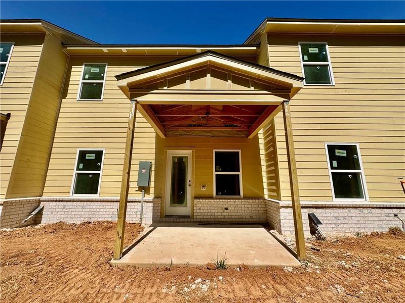Exterior details and patio area of a home in Eastlyn Crossing, Flowery Branch (Image 3).