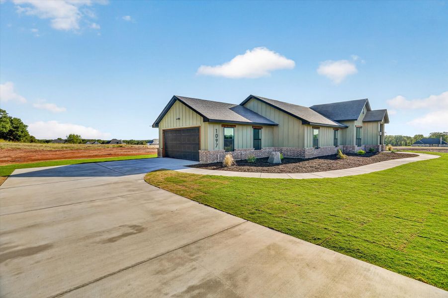 Front exterior of a new home in Taylor Ranch, Springtown, TX, highlighting curb appeal (Image 22).
