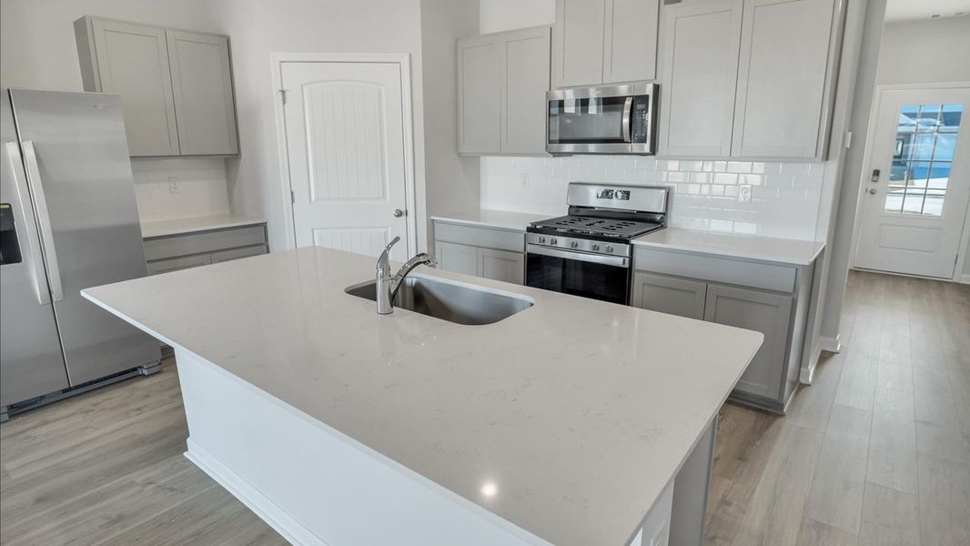 Representative furnished interior of a home built from the Arlington by D.R. Horton in Legacy Farms, White House (Image 27).