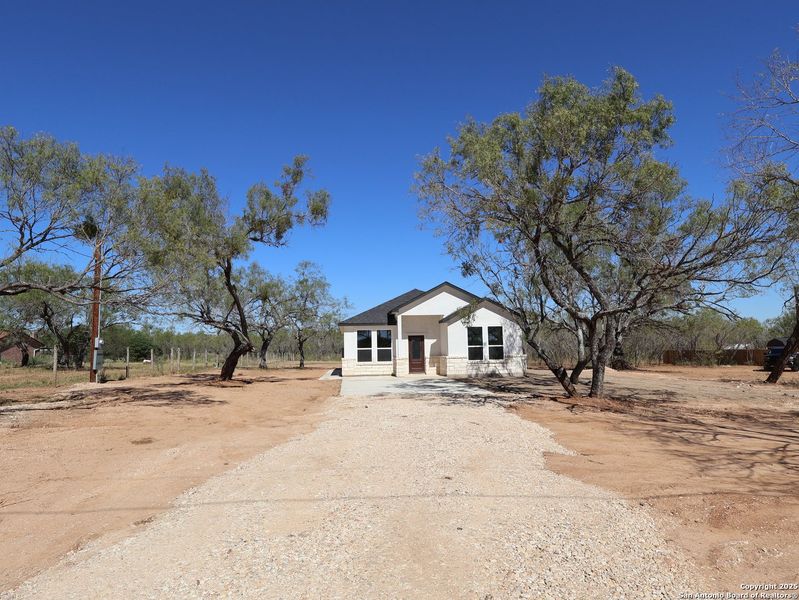Exterior details and patio area of a home in , Von Ormy (Image 10).