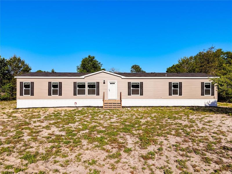 Exterior details and patio area of a home in , Pomona Park (Image 24).