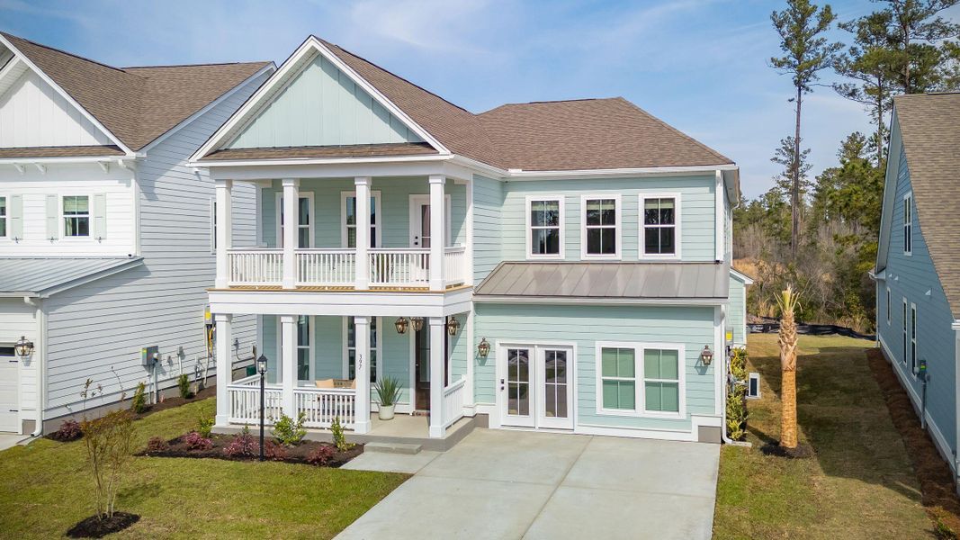 Front exterior of a new home in Cherrywood Estates, Summerville, SC, highlighting curb appeal (Image 32). Front exterior of a new home in Cherrywood Estates, Summerville, SC, highlighting curb appeal (Image 32).