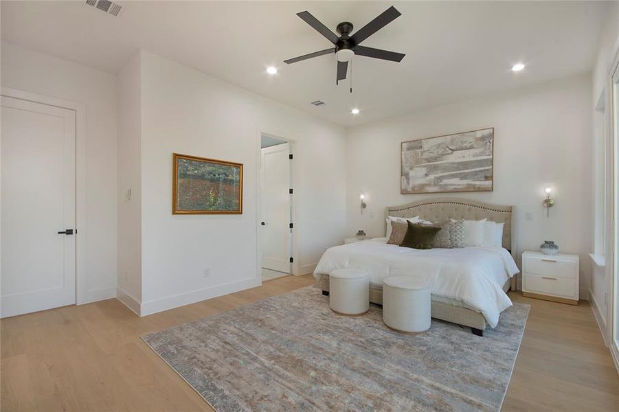 Bedroom with light wood-style flooring, recessed lighting, and a ceiling fan