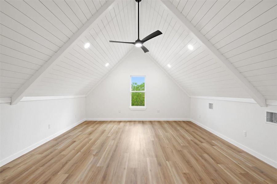 Additional living space featuring light wood-style floors, wooden ceiling, and ceiling fan Additional living space featuring light wood-style floors, wooden ceiling, and ceiling fan