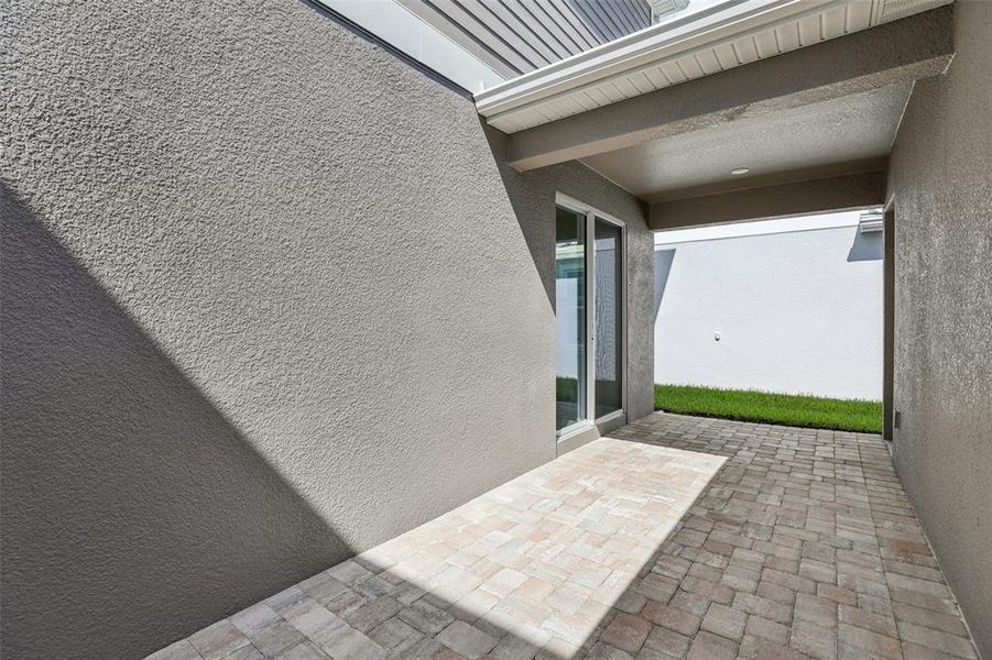 Exterior details and patio area of a home in Trinity Place, St. Cloud (Image 21).