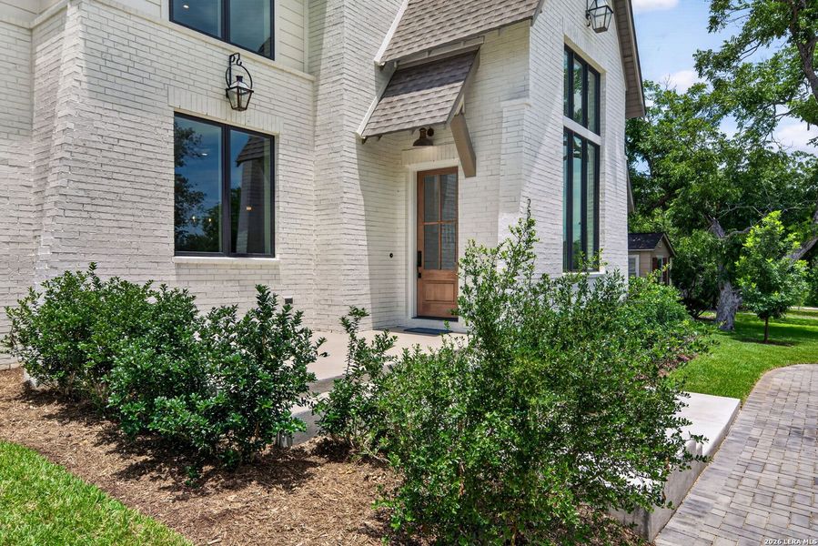 Exterior details and patio area of a home in , Alamo Heights (Image 28).