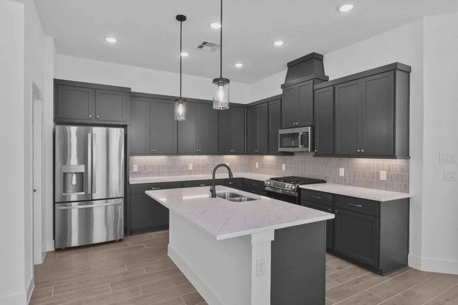 Representative furnished interior of a home built from the Versailles by Chesmar Homes in Meridiana Chateau, Manvel (Image 9).