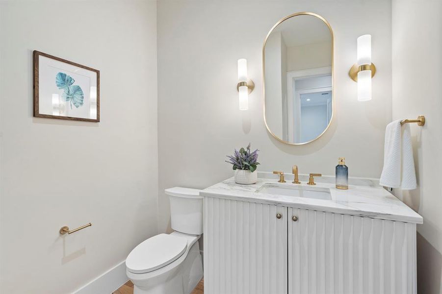 Bathroom featuring vanity and toilet