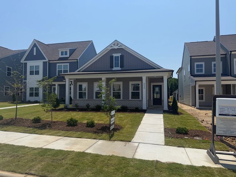 Front exterior of a new home in The Point, Rolesville, NC, highlighting curb appeal (Image 2). Front exterior of a new home in The Point, Rolesville, NC, highlighting curb appeal (Image 2).