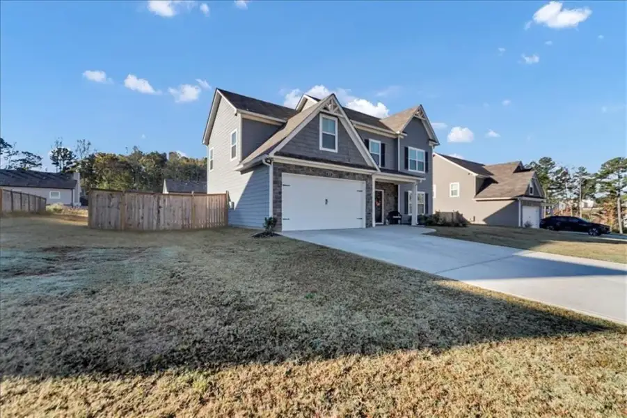 Front exterior of a new home in Traditions at Cedarcrest, Dallas, GA, highlighting curb appeal (Image 2). Front exterior of a new home in Traditions at Cedarcrest, Dallas, GA, highlighting curb appeal (Image 2).