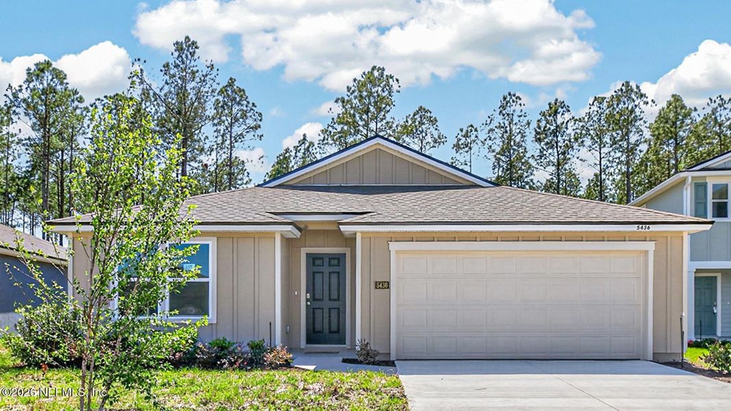 Front exterior of a new home in Copes Landing, Jacksonville, FL, highlighting curb appeal (Image 2). Front exterior of a new home in Copes Landing, Jacksonville, FL, highlighting curb appeal (Image 2).