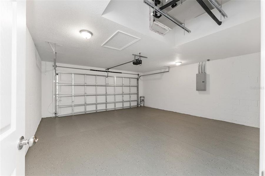 Double garage with painted floors and garage opener