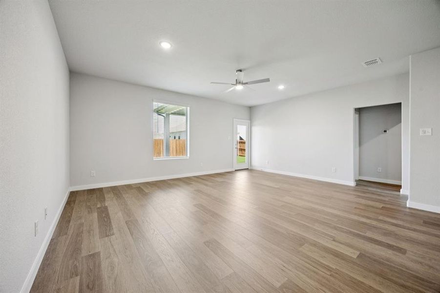 Living Room in the Haylee home plan by Trophy Signature Homes - REPRESENTATIVE PHOTO